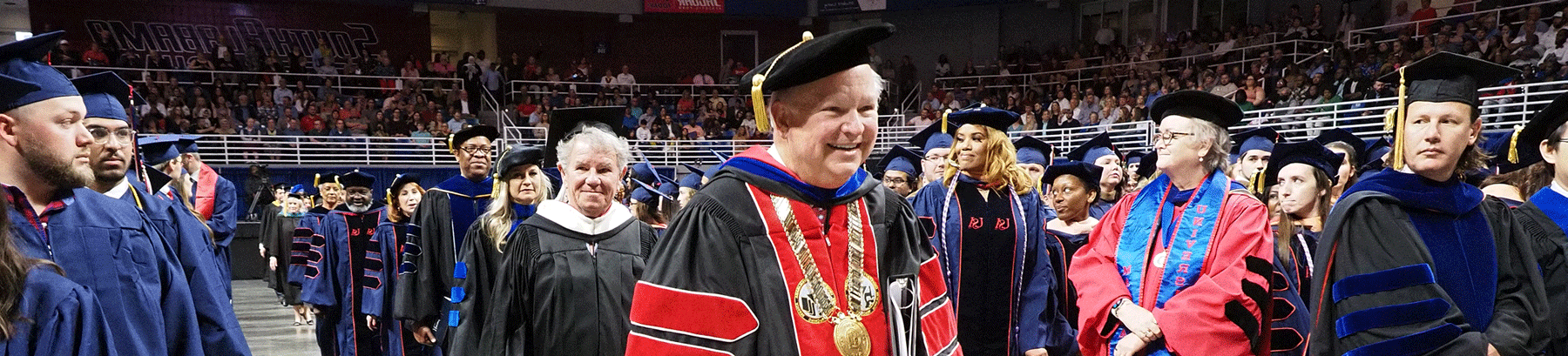 总统 Bonner leading the walk of commencement.